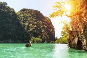 Beautiful landscape of rocks mountain and crystal clear sea with longtail boat at Phuket, Thailand. Summer, Travel, Vacation, Holiday concept