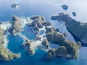 Equator Prints: Beautiful limestone islands rise from Raja Ampat's seascape