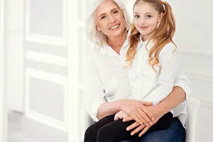 Preteen Prints: Beautiful little lady sitting on lap of her cheerful grandmother