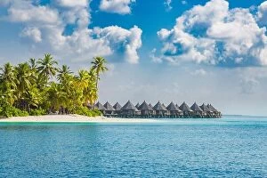 Images Dated 29th April 2016: Beautiful Maldives island beach landscape. Luxury resort with chairs