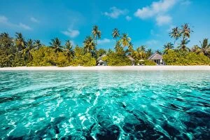 Images Dated 9th January 2017: Beautiful Maldives island beach landscape. Luxury resort with chairs