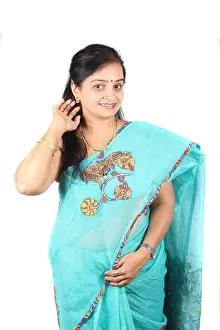 Saree Prints: A beautiful middle aged Indian woman in saree showing her earring
