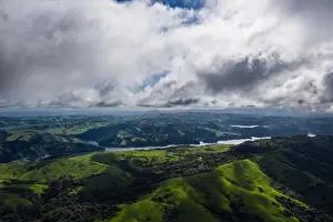 A beautiful morning lights the green hills around the San Pablo Reservoir in Northern California. A wet winter has caused lush vegetation growth