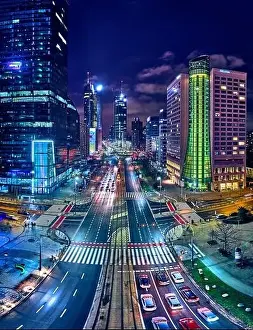 Light Night Prints: Beautiful panoramic aerial drone skyline view of the center of night Warsaw with skyscrapers in the background