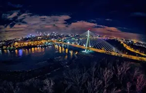 Light Night Prints: Beautiful panoramic aerial drone skyline view of the center of night Warsaw with skyscrapers in the background with