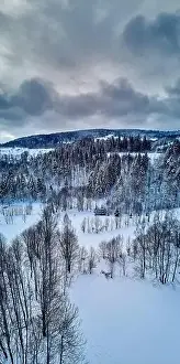 Cedar Prints: Beautiful panoramic aerial drone view on a winter landscape in the Stolowe mountains during a snowfall