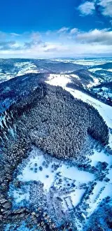 Cedar Prints: Beautiful panoramic aerial drone view on a winter landscape in the Stolowe mountains during a snowfall