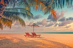 Images Dated 13th December 2018: Beautiful panoramic tropical beach. Sunset summer island landscape with love couple chairs