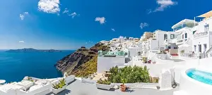 Beautiful panoramic view of picturesque town in Santorini, caldera and volcano on the Mediterranean Sea. Traditional white architecture holiday island