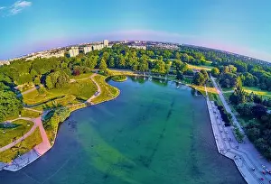 Pola Mokotowskie Prints: A beautiful panoramic view of the sunset in a fabulous evening in June from drone at Pola Mokotowskie in Warsaw