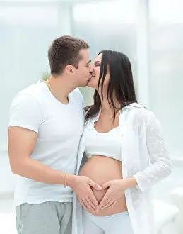 beautiful pregnant woman and her handsome husband