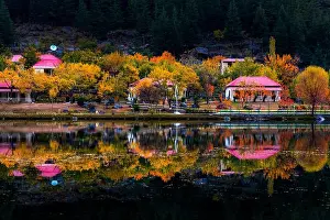Huts Prints: beautiful red huts and autumn trees reflection in the lake