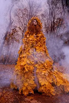 Freckles Prints: Beautiful redhead girl as a autumn in leaf cloak in forest