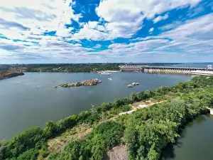Dnepr Prints: The beautiful river is surrounded by green and fresh vegetation in the city