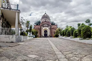 Catholic Religion Prints: Beautiful San Diego church dome view from cemetary showing stone path leading up to building with green trees