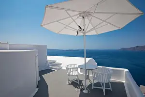 Beautiful Santorini landscape with white architecture and sea view. Sunny summer travel luxury background, cityscape, urban scenic. Idyllic streets