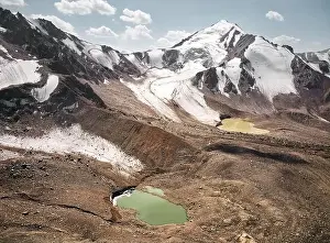 View Peak Prints: Beautiful scenery of the glacier mountain lakes with snow cap summit near Almaty city