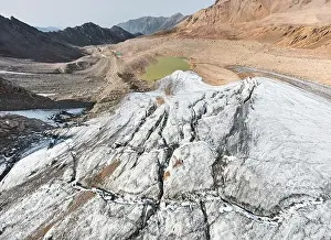 Beautiful scenery of the ice glacier with crack and mountain lakes near Almaty city