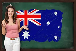 Tutor Prints: Beautiful and smiling woman showing flag of XXXXXXX on blackboard