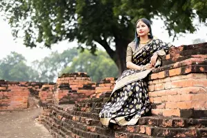 Saree Prints: Beautiful south east asian girl in traditional Indian sari/saree on temple background