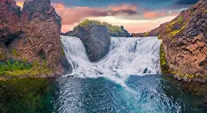 Beautiful summer scenery. Splendid outdoor scene of Hjalparfoss Waterfall