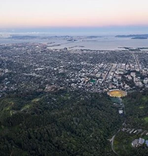 Aerial Landscape Collection: A beautiful sunrise illuminates Oakland, Berkeley and San Francisco Bay in Northern California