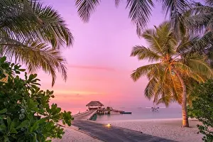 Sunset Beach Prints: Beautiful sunset beach scene. Wooden jetty colorful sky and clouds view with calm sea and relaxing tropical mood