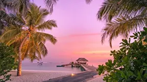 Beautiful sunset beach scene. Wooden jetty colorful sky and clouds view with calm sea and relaxing tropical mood. Exotic tropical landscape nature
