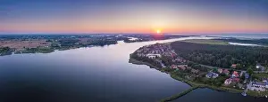 Vistula Prints: Beautiful sunset over estuary of Vistula river in Gdansk. SUmmer sunset over sea and river