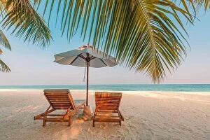 Images Dated 7th January 2017: Beautiful sunset relax beach. Chairs on sandy beach near the sea