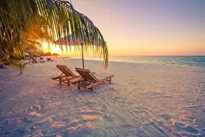 Beautiful sunset relax beach. Chairs on sandy beach near the sea. Summer holiday and vacation concept for tourism. Inspire romance tropical landscape