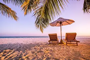 Beautiful tranquil beach. Chairs on the sandy beach near the sea. Summer holiday and vacation concept for tourism. Inspirational tropical landscape