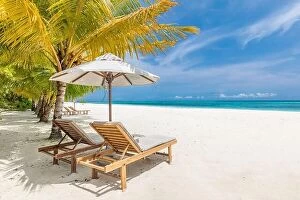 Images Dated 30th May 2019: Beautiful tropical beach. White sand and coco palms chairs, umbrella travel tourism