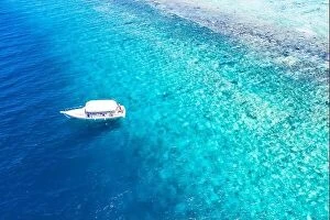 Images Dated 3rd June 2019: Beautiful turquoise ocean water boat top view aerial photo. Aerial view speed boat in the sea