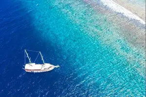 Dominican Prints: Beautiful turquoise ocean water boat top view aerial photo