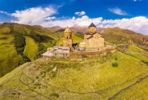 Beautiful Top view from drone to Tsminda Sameba or Holy Trinity Church Near Village Of Gergeti In Georgia