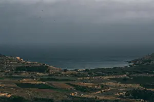 Grass Hill Prints: Beautiful view from hill of Gozo to sea and fields