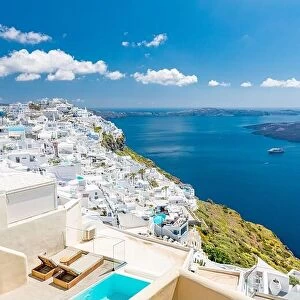 Images Dated 11th May 2019: Beautiful white caldera view of Santorini in Greece. Luxury hotel resort pool over white