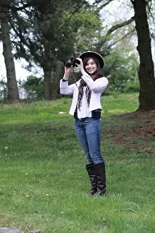 Binoculars Prints: beautiful young lady in the country looking at and studying birds and wild life