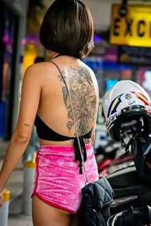 Pattaya Prints: A beautiful young Thai lady with a stunning tattoo makes her way into 7-11 on Soi Buakhao in Pattaya Thailand