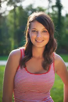 Inviting Prints: Beautiful young woman in her 20s looks at camera smiling