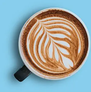 Coffee Cup Prints: A beautifully crafted latte with intricate foam art, showcasing a blend of coffee and milk