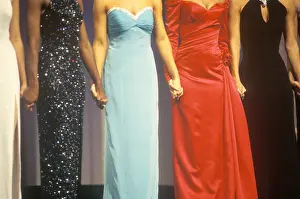 Group Of Prints: Beauty pageant contestants wearing gowns and holding hands