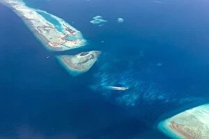 Images Dated 22nd May 2019: Beauty tropical island. Aerial view on tropical islands in the Indian ocean, atolls with coral reef