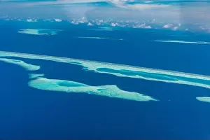 Beauty tropical island. Aerial view on tropical islands, drone, plane view from coral reef atoll in Maldives islands. Exotic travel nature destination
