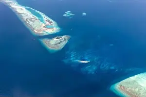Beauty tropical island. Aerial view on tropical islands in the Indian ocean, atolls with coral reef. Exotic seascape aerial landscape