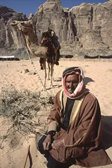 Horseman Prints: Bedouin tribesman with his camel in Wadi Rum Jordan