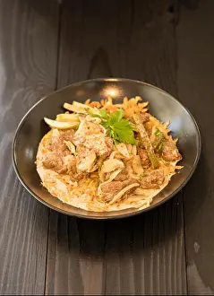 Casserole Prints: beef stroganoff in black plate of beef, mushroom and onion in cream sauce