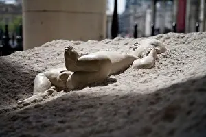 In the beginning sculpture of a new born baby at St Martin in the Fields Church London England UK