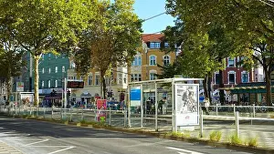 People Walking Prints: Belsenplatz in the district of Oberkassel in Düsseldorf/Germany with bus and tram stations